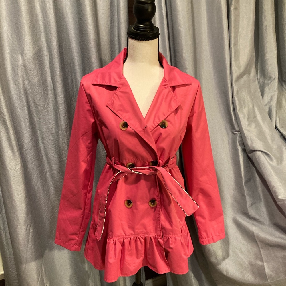 Girls trench coat.Pink w/ ruffle bottom.Like new.